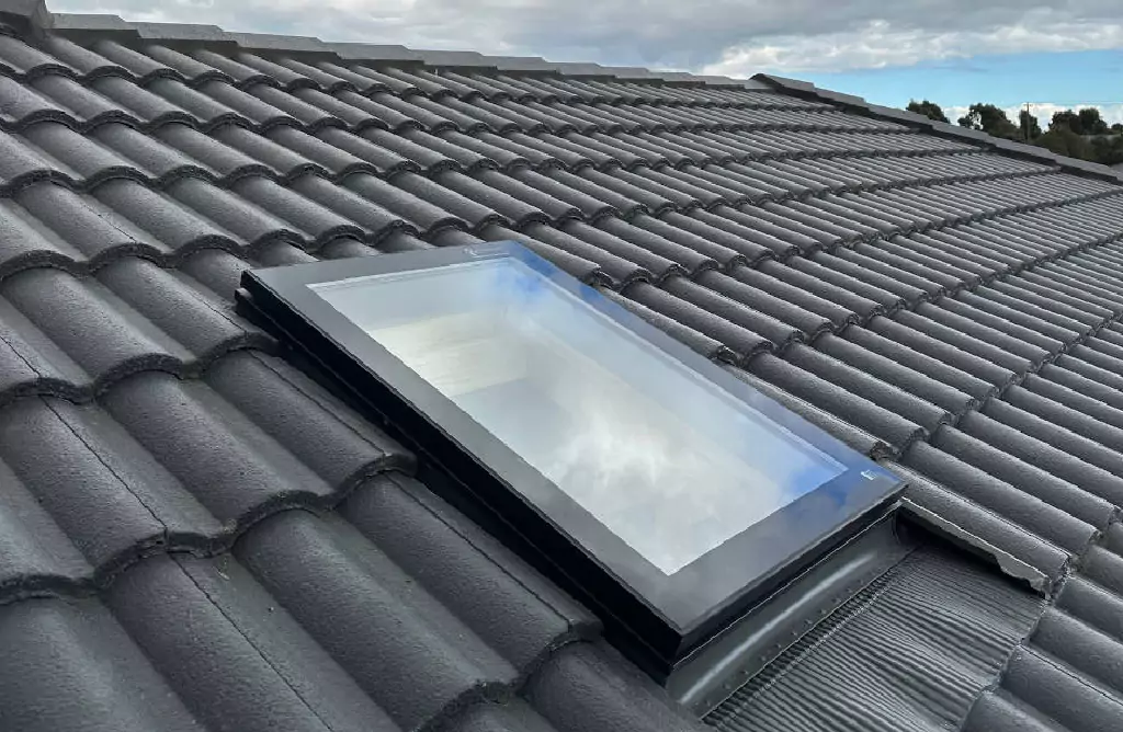 Skylight on Tiled Roof, Reflecting Clouds