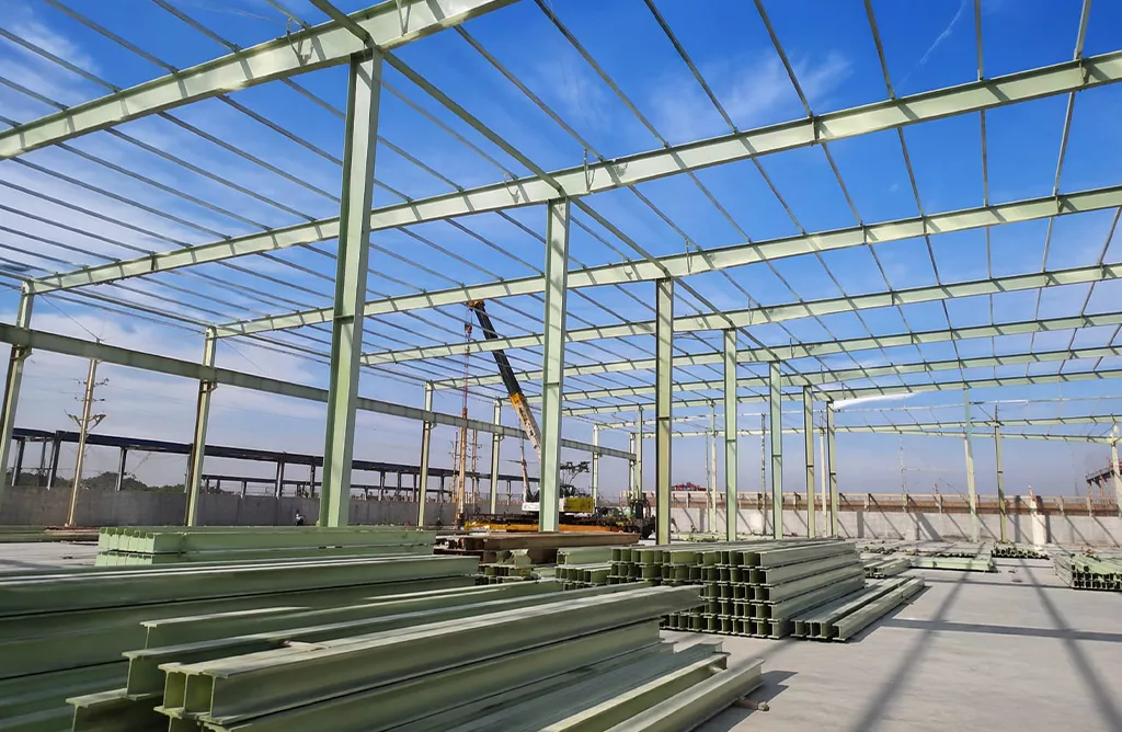 Industrial shed construction with steel structure and FRP roofing sheets installation